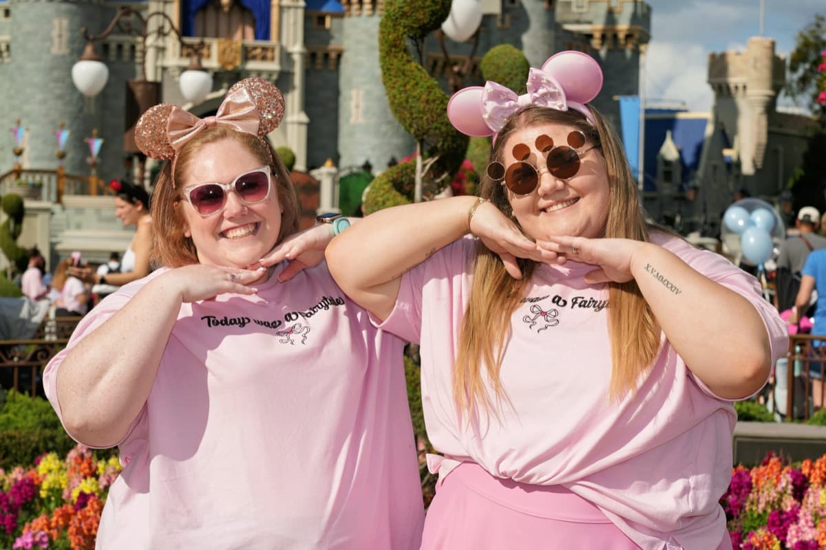 Julianna and family on a pink-themed day at the Disney castle